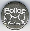 Police In Custody 80 small round button.jpg