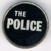 The Police round metal badge white logo.jpg