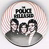 1979 08 Police released white background black round button.jpg