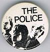 1979 09 Police fin costello white background small round button.jpg