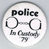 Police In Custody 79 white black letters large round.jpg