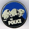 1978 promo photo round metal badge dark blue.jpg