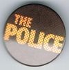 The Police small button yellow red on black.jpg
