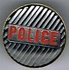 The Police round metal badge striped red.jpg