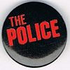 The Police small round button diff logo dark red on black.jpg