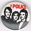 1979 08 Police white background red letters round button.jpg