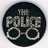 The Police button handcuffs.jpg
