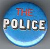 The Police round button original logo red and white on blue.jpg