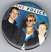 1983 Synchronicity photo shoot larger blue round button.jpg