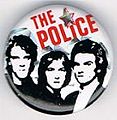 1979 08 Police white background red letters star glitter round button.jpg